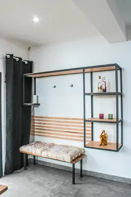 a bathroom sink with a white bowl on a wooden shelf at Casa da Vila Apartments in Arco da Calheta