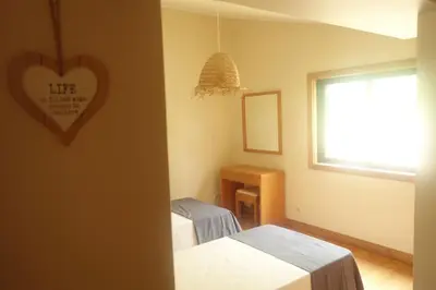 a bathroom with a shower and a toilet and a sink at Heritage Villa Porto Santo in Porto Santo