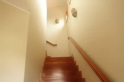 a room with a stairwell with a window and a stair case at Heritage Villa Porto Santo in Porto Santo