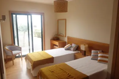 a bathroom with a bath tub and a sink at Heritage Villa Porto Santo in Porto Santo