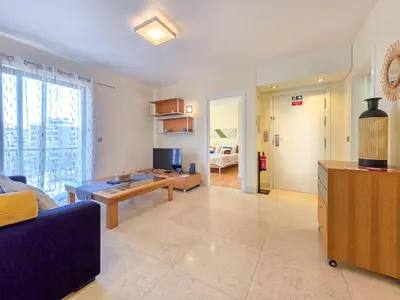 a living room with a couch and a table at Fórum Madeira Residence in Funchal