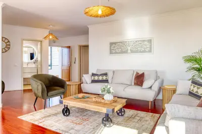 a living room with a couch and a table at Funchal Panoramic View, a Home in Madeira in Funchal