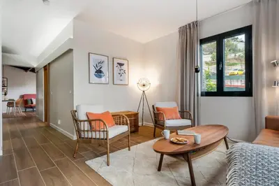 a living room with a couch and a table at Villa Monte in Funchal