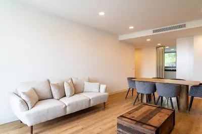 a living room with a couch and a table at A peaceful retreat near the city centre in Funchal