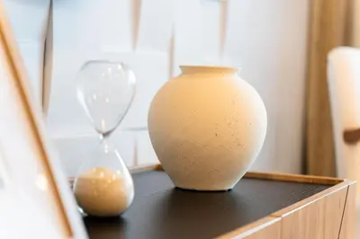 a vase and an hourglass sitting on a table at A peaceful retreat near the city centre in Funchal