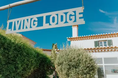 a street sign that reads living lodge at Living Lodge Portugal in Aljezur