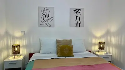 a bedroom with two lamps and a bed at Rosalita s View in Funchal