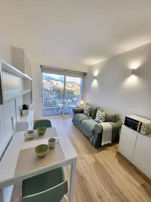 a living room with a couch and a table at Apartamento Vista Mar in Funchal