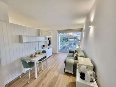 a living room with a couch and a table at Apartamento Vista Mar in Funchal