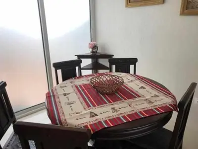 a table with a table cloth on top of it at GuestReady - Vila Rosa - Renovated Seaviews House in Funchal