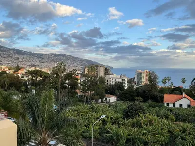 a view of a city with buildings and the ocean at Sol & Mar Casa Branca in Funchal