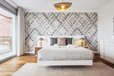 a bedroom with a white bed and a wall mural at Suburban Views by Homie in Funchal