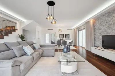 a living room with a couch and a tv at Suburban Views by Homie in Funchal