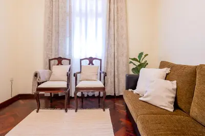 a living room with two chairs and a couch at Domingos House - Valley View in Boaventura