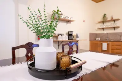 a white vase sitting on top of a table at Domingos House - Valley View in Boaventura