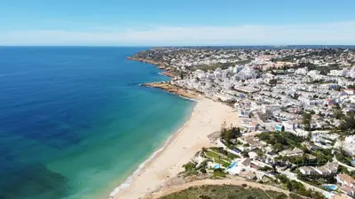an aerial view of a beach and the ocean at Baleias Guesthouse - 3 Bedroom Townhouse with private pool & sea view in Luz