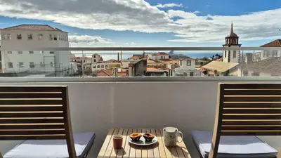 a plate of food on a table on a balcony at GuestReady - Relax and Recharge in Funchal in Funchal