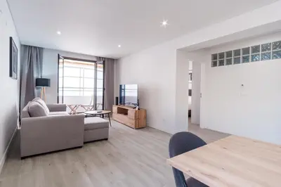 a living room with a couch and a table at GuestReady - Relax and Recharge in Funchal in Funchal