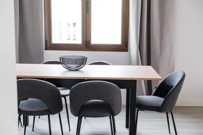 a dining room table with chairs and a bowl on top at GuestReady - Relax and Recharge in Funchal in Funchal