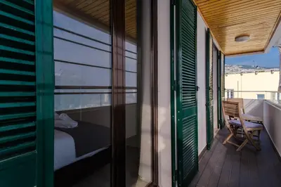 a balcony with a bed and a view of the ocean at GuestReady - Relax and Recharge in Funchal in Funchal