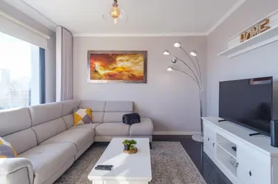 a living room with a couch and a tv at GuestReady - Private Terrace Stay in Funchal