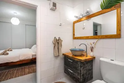 a bathroom with a sink and a mirror at Studio Sardinha-1 min walk to beach in Burgau