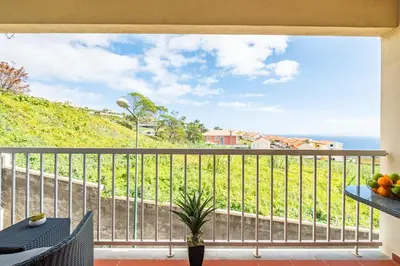 a balcony with a view of the ocean at SUPER Atalaia in Caniço