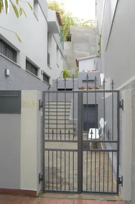 a gate in a courtyard with a building at Apartamentos Turísticos Vitoria by Petit Hotels in Funchal
