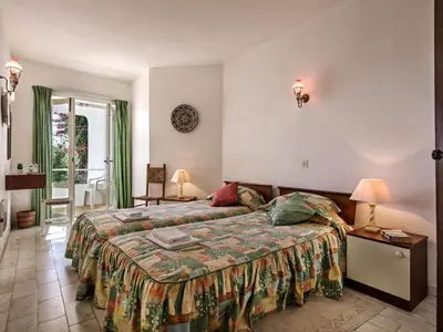 a hotel room with a bed and a window at Villa Bort Oss in Luz