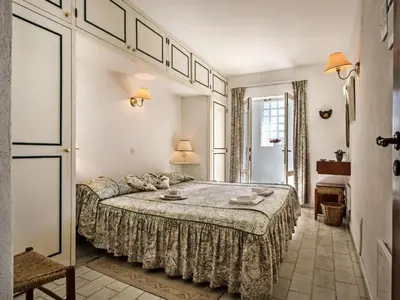 a bedroom with a large bed in a room at Villa Bort Oss in Luz