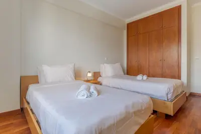 two beds sitting next to each other in a bedroom at Ivanna Apartament by Holiday Rental Madeira in Funchal