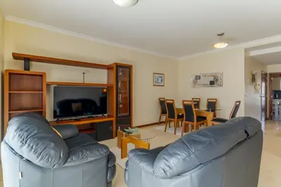 a living room with a couch and a television at Ivanna Apartament by Holiday Rental Madeira in Funchal