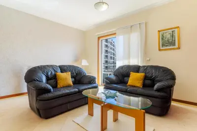 a living room with two leather couches and a table at Ivanna Apartament by Holiday Rental Madeira in Funchal