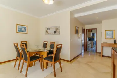 a dining room with a table and chairs at Ivanna Apartament by Holiday Rental Madeira in Funchal