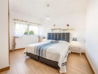 a bedroom with a bed and a window at Apt. A Nice Home in Lagos