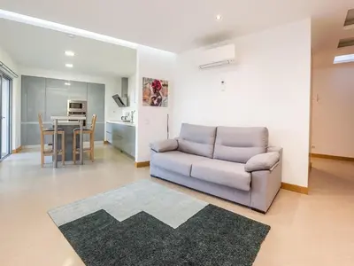 a living room with a couch and a table at Apt. A Nice Home in Lagos