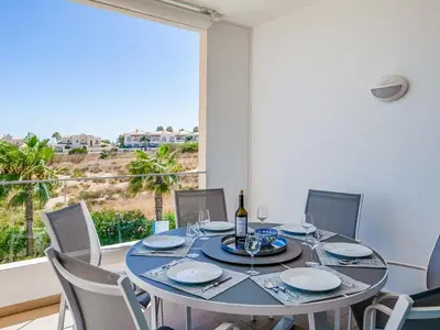 a dining room with a table and chairs and a window at Apt. Seabreeze in Lagos