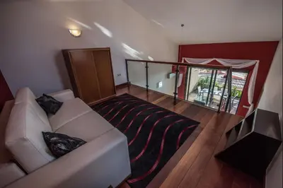 a living room with a white couch and a balcony at Apt. Arribas in Luz