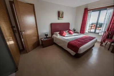 a bedroom with a bed and a large window at Apt. Arribas in Luz
