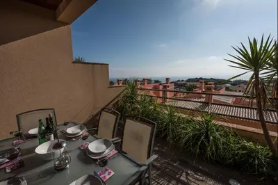 a table and chairs on a balcony with a view at Apt. Arribas in Luz