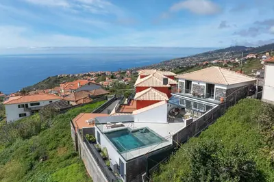 a house with a view of the ocean at Villa Island Roots by An Island Apart in Calheta