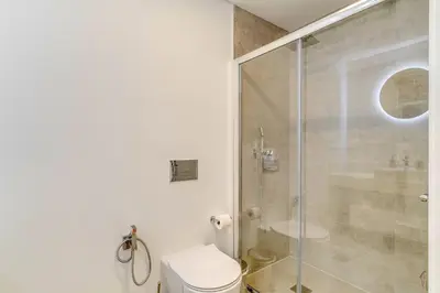 a bathroom with a toilet and a glass shower at Luxury Laura Apartment by Holiday Rental Madeira in Funchal