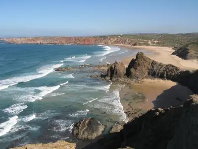 an aerial view of a beach with rocks and the ocean at Casa 3 in Raposeira