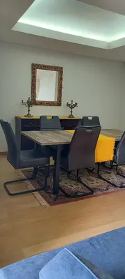 a dining room with a table and chairs at Vista Praia Apartment in Funchal