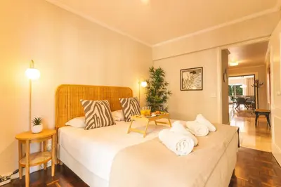 a hotel room with two beds and a table at Costa Azul by Atlantic Holiday in Funchal
