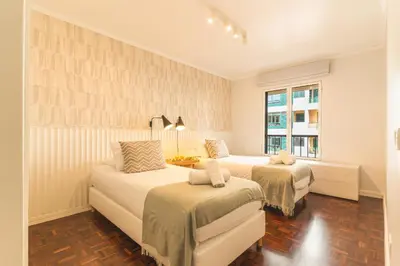 a bedroom with two beds and a window at Costa Azul by Atlantic Holiday in Funchal