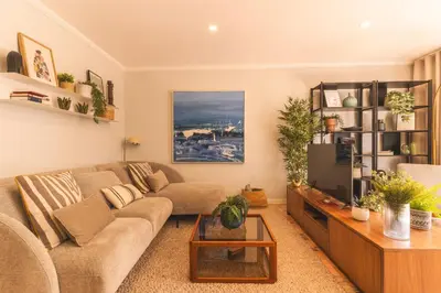 a living room with a couch and a tv at Costa Azul by Atlantic Holiday in Funchal