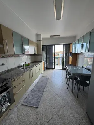 a kitchen with a table and a dining room at Barreiros View Vacations in Funchal