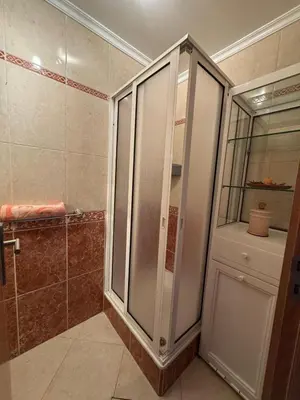 a bathroom with a shower with a glass door at Barreiros View Vacations in Funchal