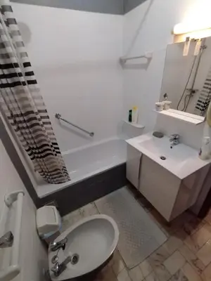 a bathroom with a sink and a toilet and a tub at Casa Francis in Aljezur